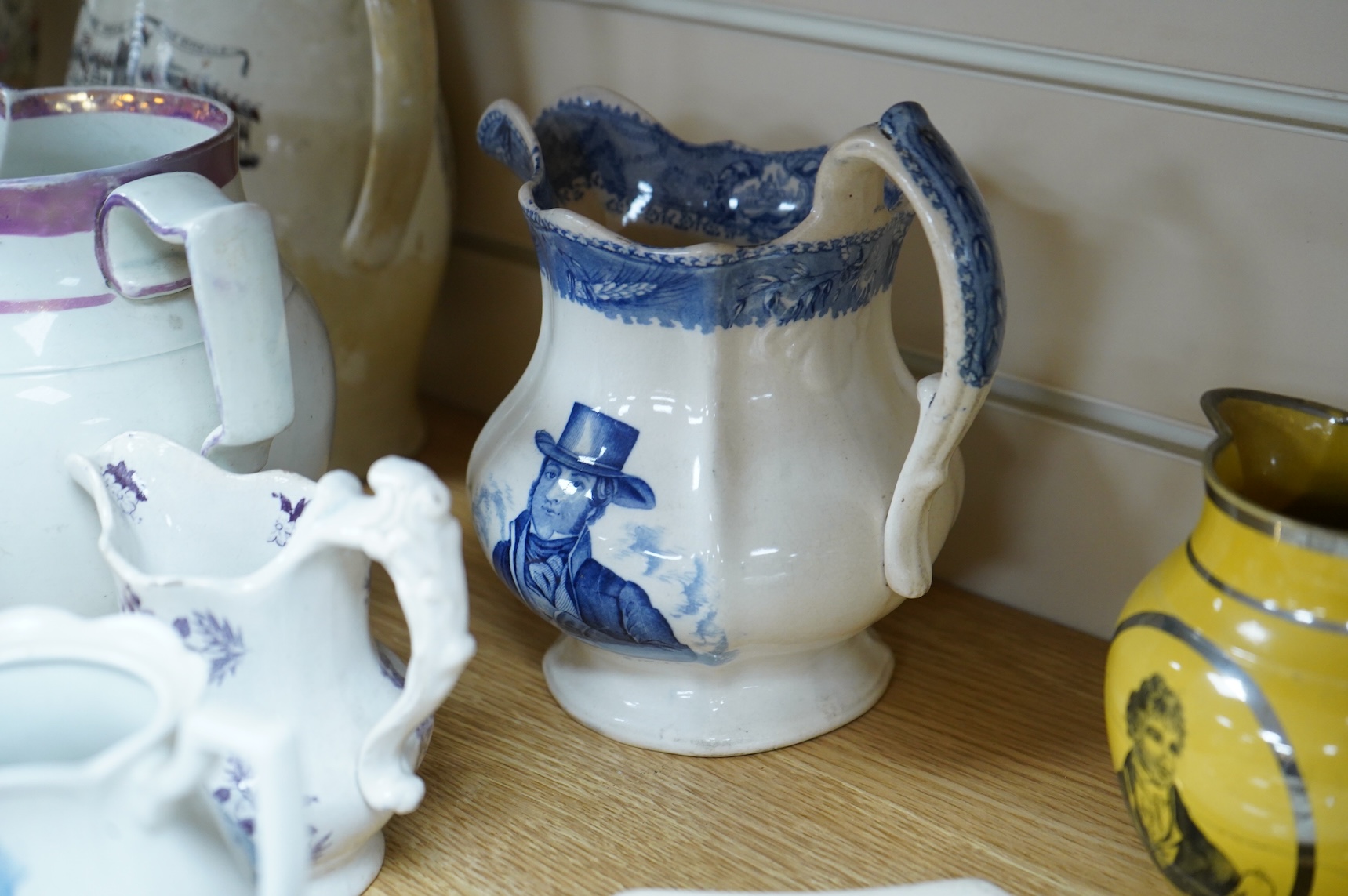 Eleven early to mid 19th century jugs, mugs and plates, all with transfer printed commemorative themes including Gladstone as Prime Minister, Queen Victoria‘s 1887 Jubilee, the Bidston Lighthouse Signals, Lord John Russe
